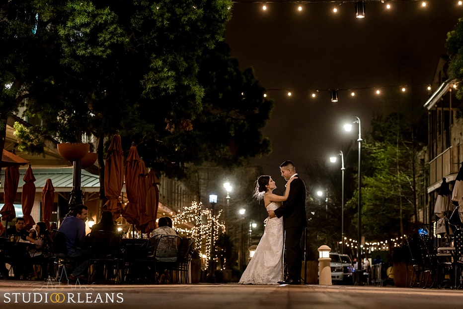 We take the couple outside for some nighttime creative portraits by Fulton Alley in New Orleans