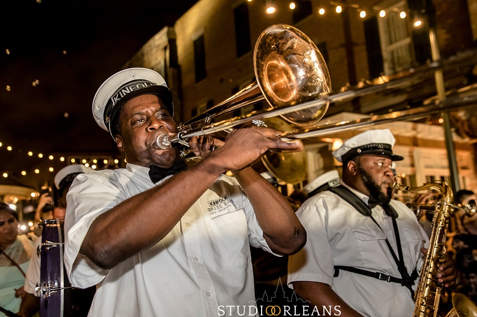 Kinfolk brass band playing for a second line on Fulton Alley in New Orleans