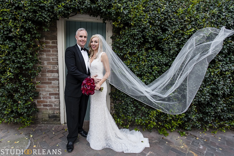 Bride and groom posing in the French Quarter after there beautiful elopement