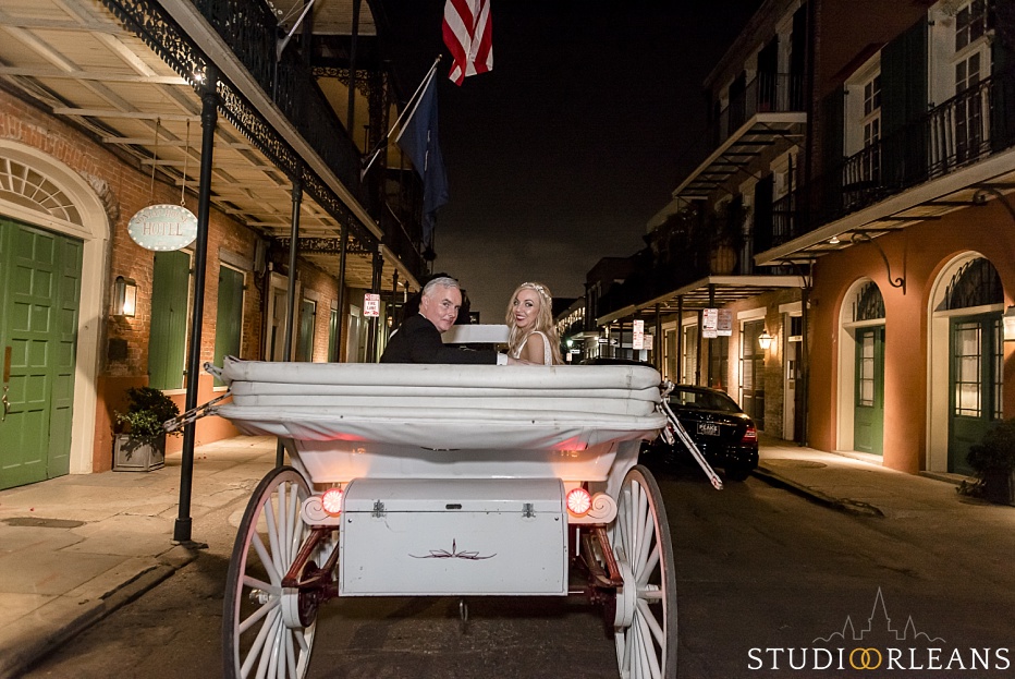 Bride and groom in the French Quarter in a horse and carriage after there beautiful elopement in New Orleans