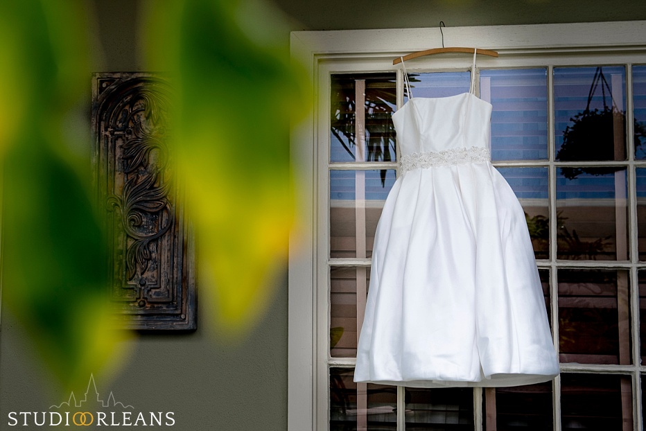 Beautiful wedding dress hanging in New Orleans at the Bienville House