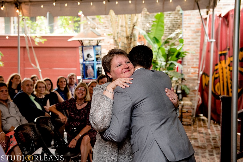 The bride hugs her mom for her wedding in New Orleans at The House of Blues wedding - Same sex wedding