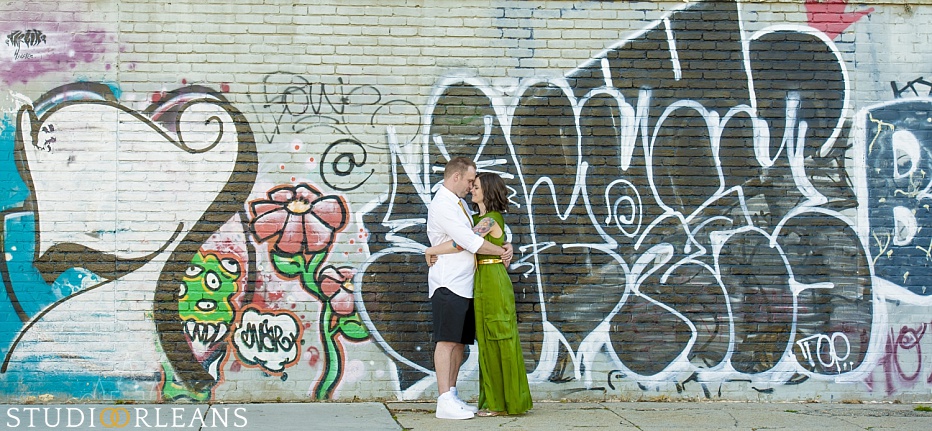 New Orleans Engagement session in the Marigny in front of some grafitti