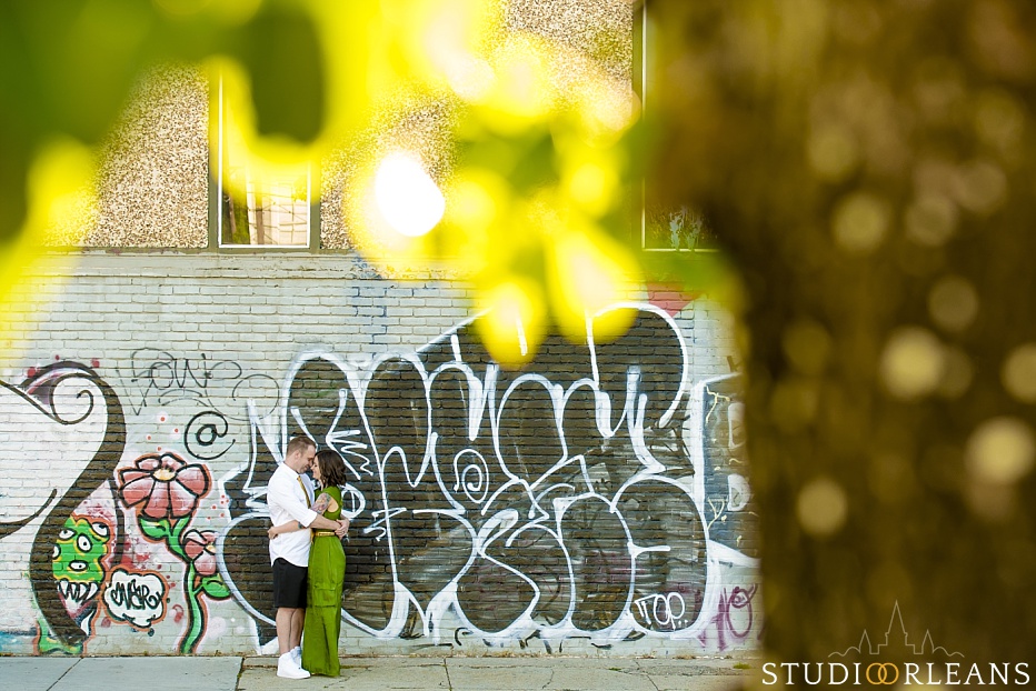 New Orleans Engagement session in the Marigny in front of some grafitti