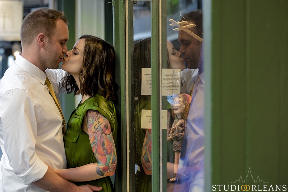 New Orleans Engagement Session in the French Quarter with the bride and groom reflection in the glass