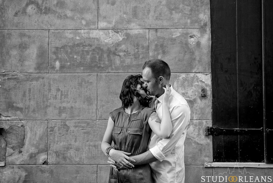 New Orleans Engagement Session in the French Quarter with a historic building in the background