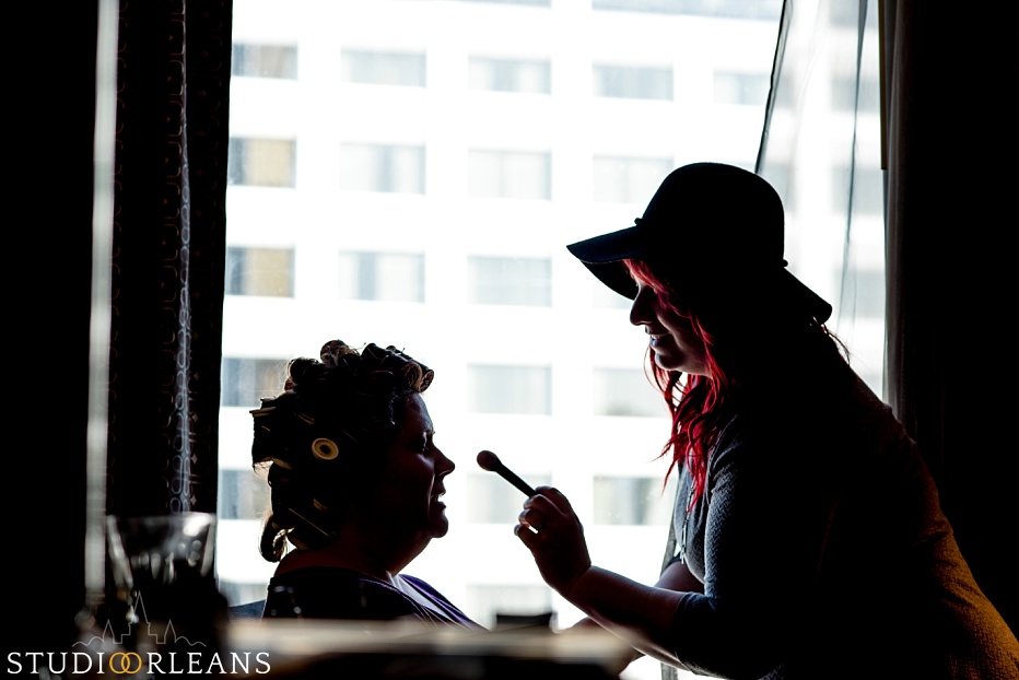 A bride and her makeup artist get ready for her special day in New Orleans