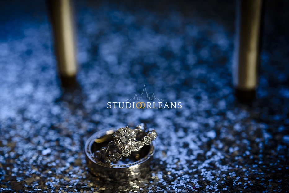 Beautiful wedding rings with high heals in the background