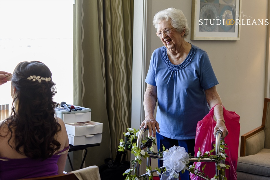A grandmother watches her grand daughter get a her touches of makeup before her wedding