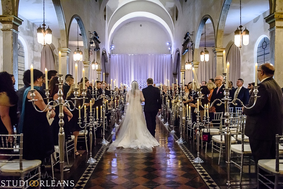 A father walks his daughter up the aisle at the beautiful Marigny Opera house for her wedding