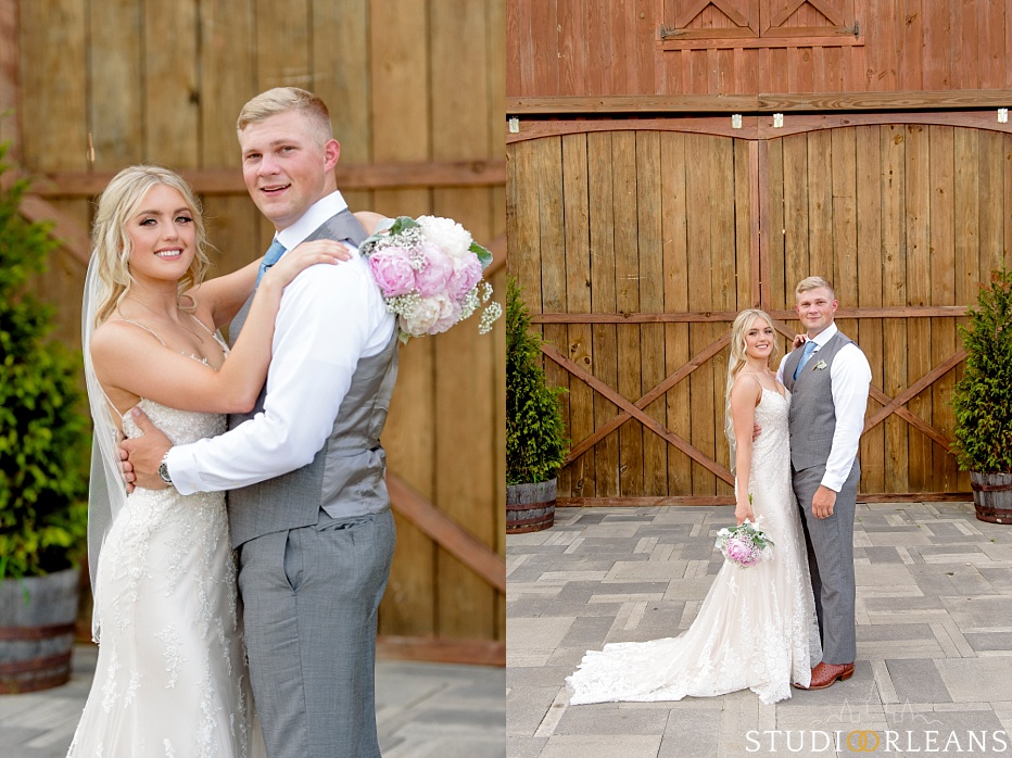 The bride and groom pose for a picture at The Berry Barn