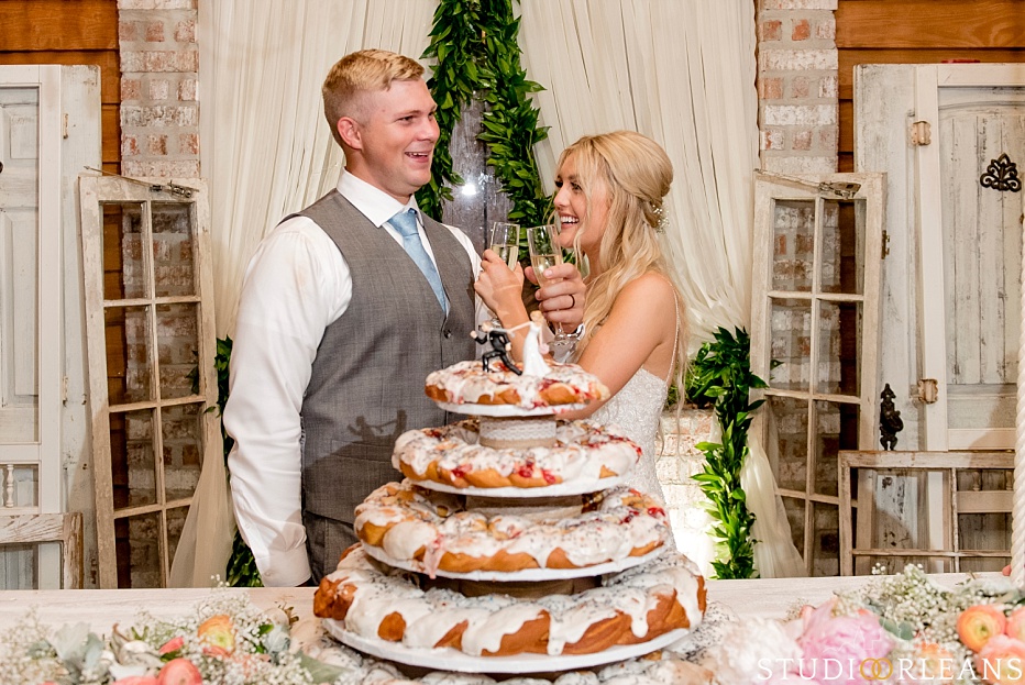 The couple do a toast at the Berry Barn