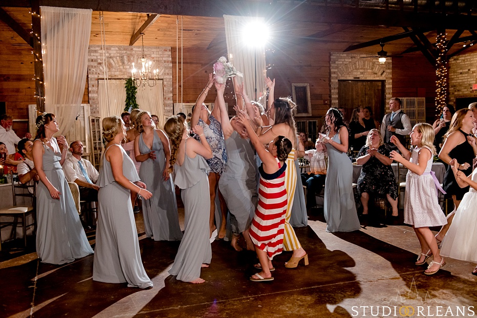 The bouquet toss a the Berry Barn