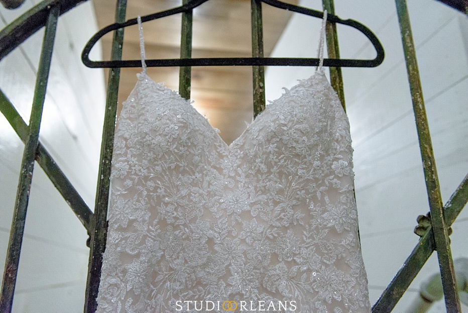 A beautiful wedding dress hanging at the Berry Barn in Amite LA